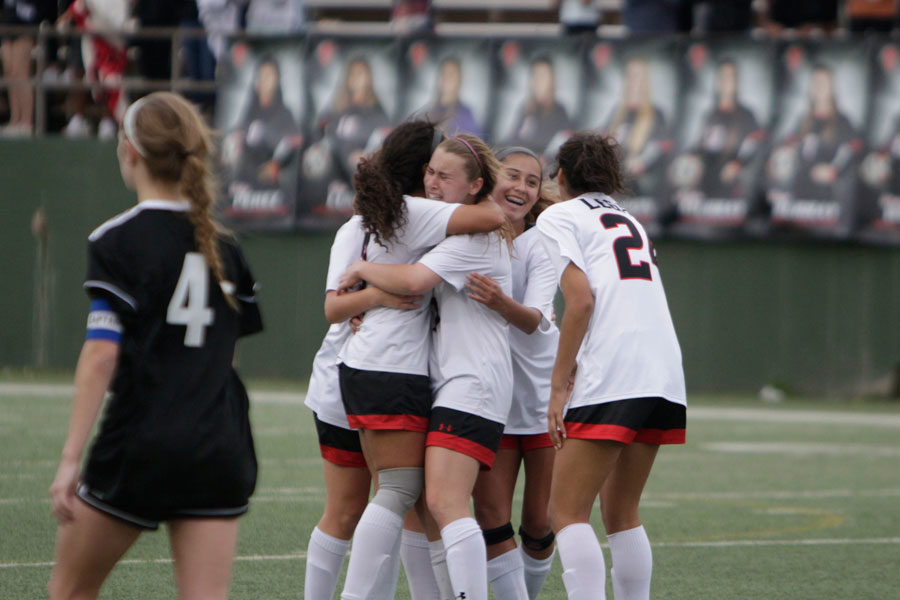 The team celebrates in the final seconds of their game against Aledo. They defeated Aledo 1-0.