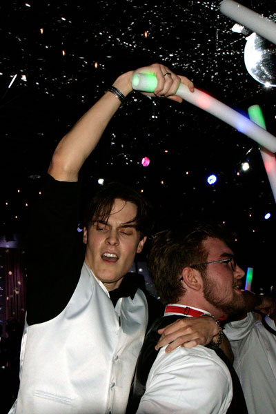 Zachary Carpenter, 12, dances at prom. The DJs handed out glowing foam noodles to dance with.