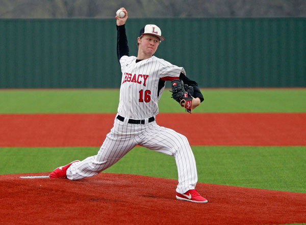 Shawn Newberry, 11, throws a pitch in their game against Waxahacie. 