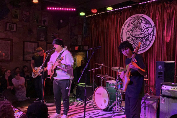 Eli Saenz, 12, performs on stage as lead singer for his band Housecall. 