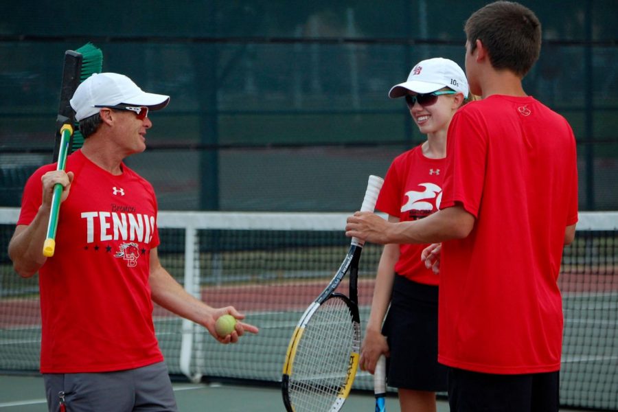 Coach Chad Redwine jokes with Megan Novak, 12, before the match. (Brooklyn Hilmes photo)