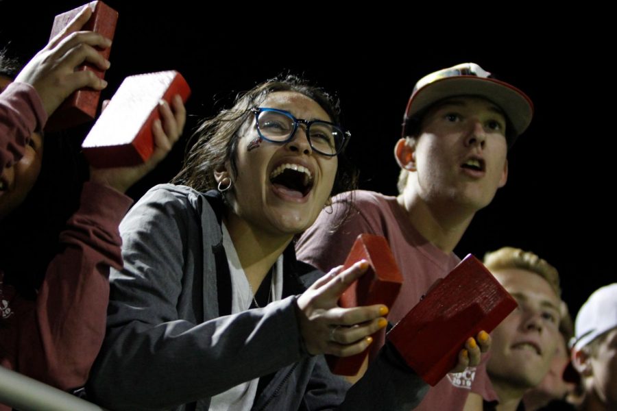 Jasmine Suarez, 12, cheers on the football team during the game. (Maija Miller photo)
