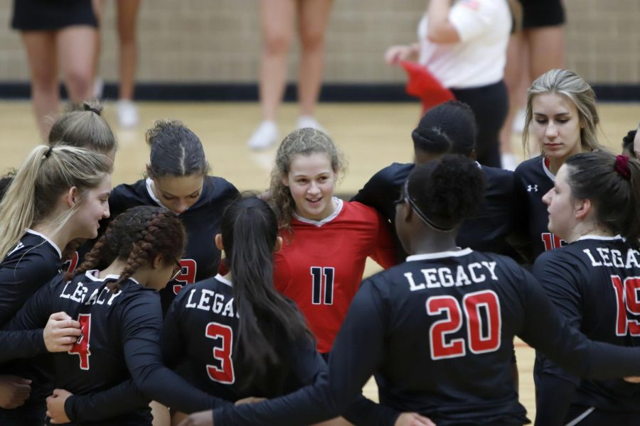 Payton Hyden, 11, and teammates huddle during game against Everman on Sep. 20.