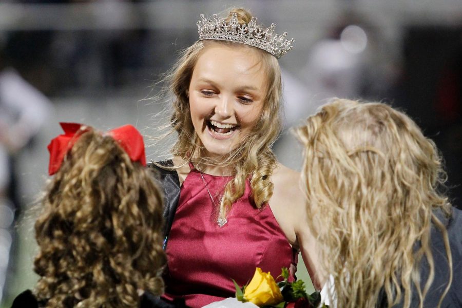 Kamryn Hennigan, 12, accepts the crown and sash as she is announced queen at the homecoming game. (Madison Gonzales photo)