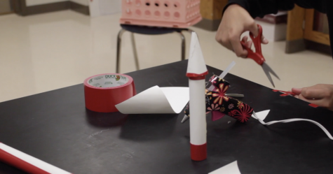 Students build their rockets to launch in their physics class. 