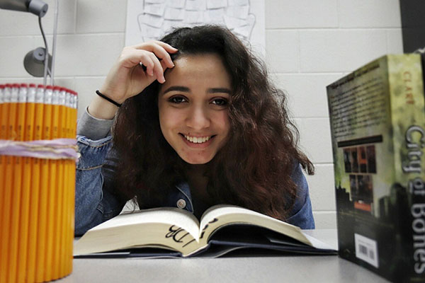 Lana Abdularezeq, 11, poses for a picture in Mrs. Bennett's classroom. Abdularezeq is the unofficial Vice President of author's club.