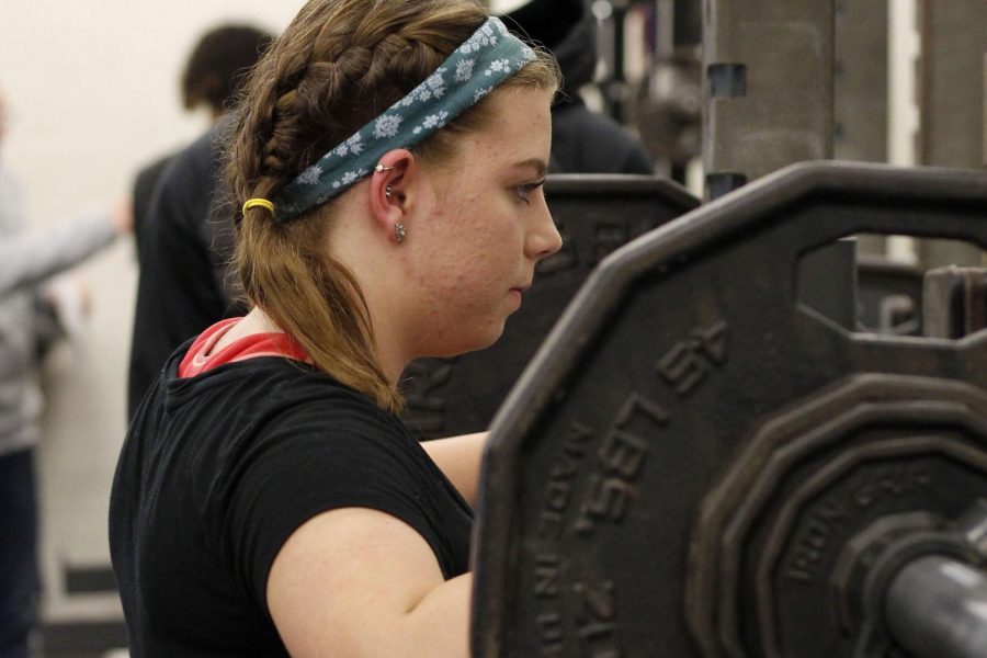 Johanna Leduc, 11, prepares to squat at Legacys powerlifting meet on Feb. 5.