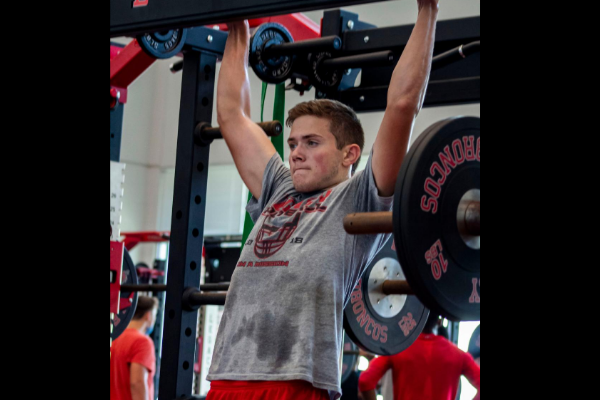 Senior Josh Martin works out in the weight room. 