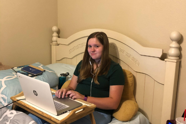 Senior Hannah Brantley completes her school work from her bed when all classes were virtual at the start of the school year.