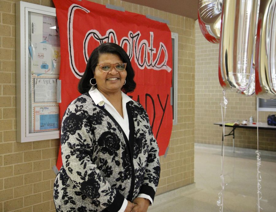 Dr. Ready poses for a picture with a sign at her congratulatory party on Oct. 29.