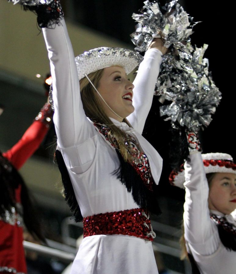 At the game against Birdville, Allye Hand, 11, dances with drill team after the Legacy football team scores their first touchdown of the game. (Hayley Parsons Photo)