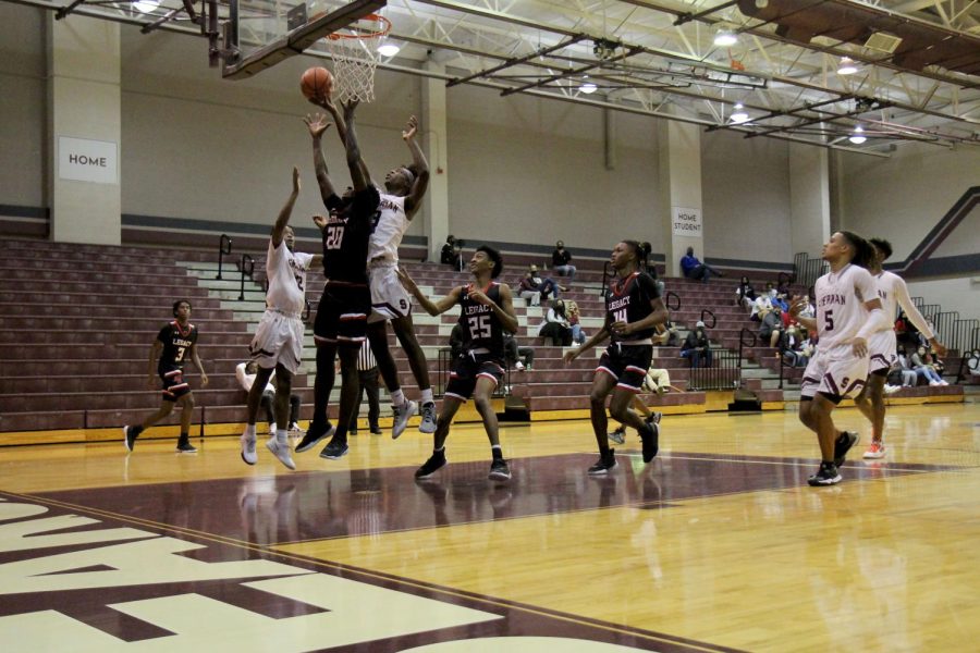 Micah Juiye, 11, jumps to lay-in the ball against Sherman High School.