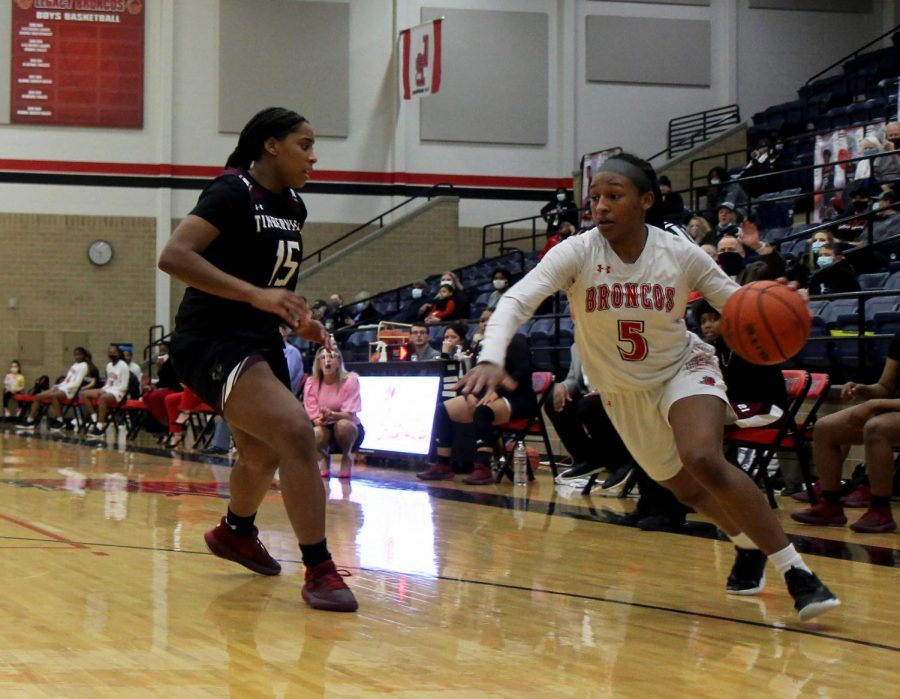 Savannah Catalon,10, drives past a defender in the game versus Timberview.
