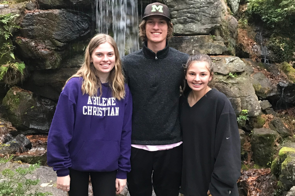 Audrey, Hudson and Emily McReynolds pose together while on vacation as a family.