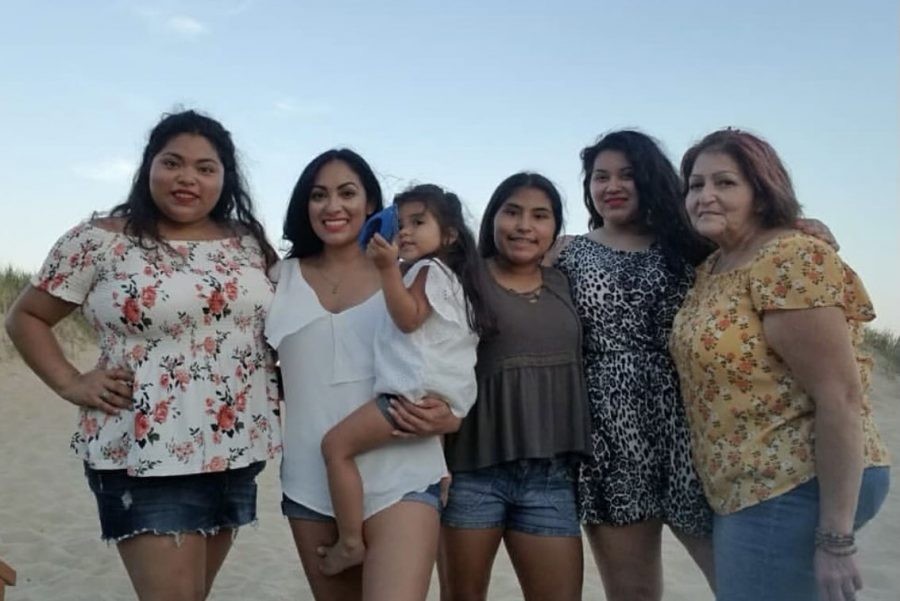 Molina poses for a picture with her mom and sisters. 