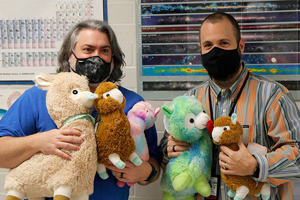 Science teachers Mr. Davis and Mr. Subdbury pose together for a picture in the science lab. 