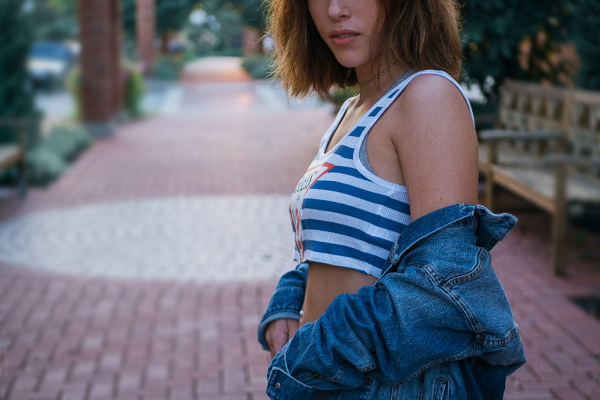 Crop tops and tank tops are banned in the current dress code. (Photo by Mark Decile on Unsplash)