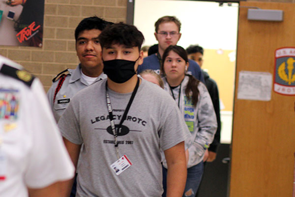 Samuel Ramirez, 9, and other JROTC members walk in line to the cafeteria on Oct. 6, during modified lockout procedures. Legacy went into a modified lockout during the active shooter incident at Timberview High School. 