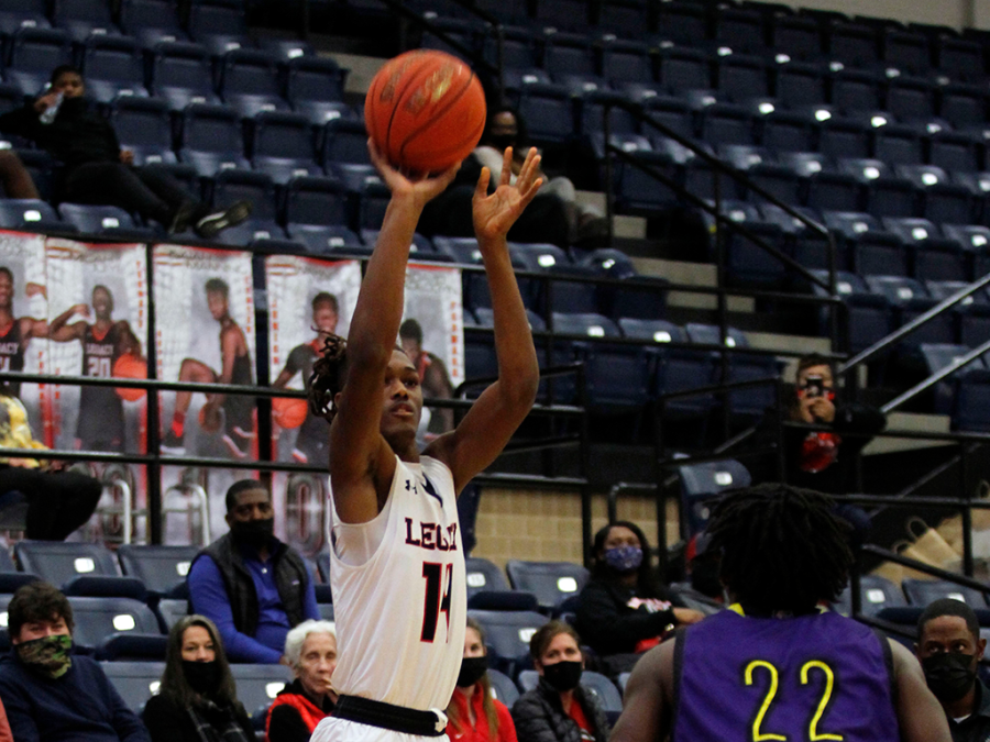 Rykeiz Smith, 12, shoots for the basket during Legacy vs Everman game last season. 