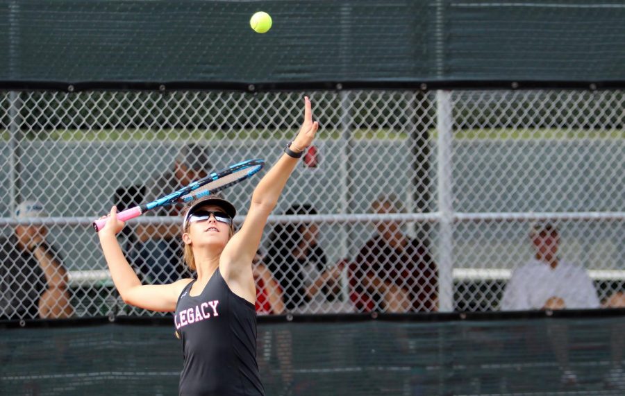 London Laurence, 9, hits the ball at the match against Crowley on September 28. Tennis won the match 19-0. 
