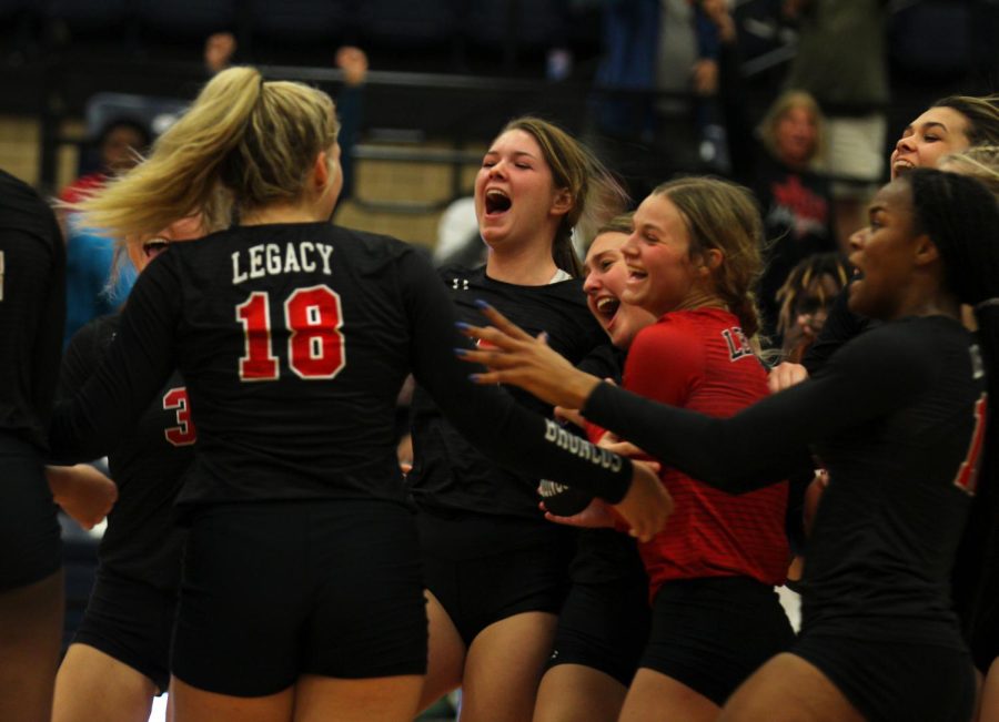Volleyball celebrates together at the Legacy vs. Burleson varsity game.  