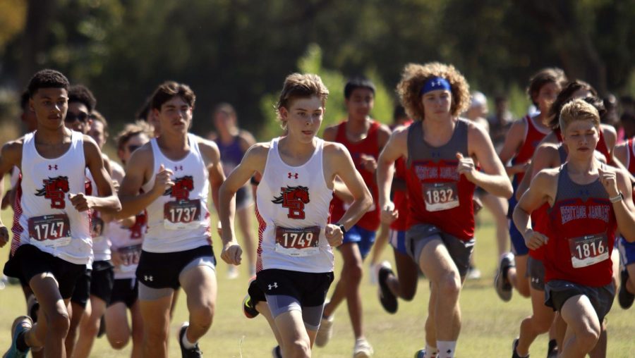 Cross Country athletes run at the meet at Chisenhall Park in Burleson. The boys took third place in the varsity race.