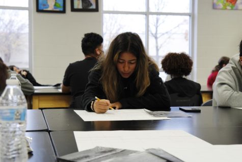 Priscilla Perez, 10, works on an assignment in class. Perez plays on the girls varsity soccer team.