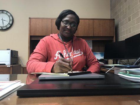 Dr. Butler works in her office. After nine years as principal, she plans to move to central administration. Her last last day at Legacy is June 24.