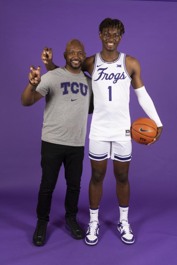 Manning poses with his father in a college visit at Texas Christian University. 