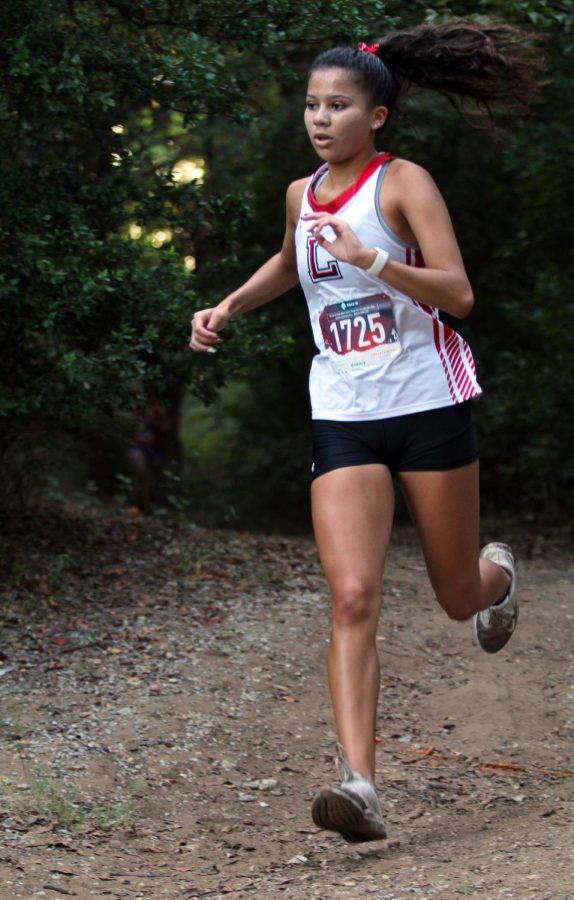 Senior Leilani Fierro runs at Chisenhall Park on Sept. 17, 2021. Fierro is the team captain for the cross country team, as well as the Editor in Chief for The Rider Online. [File Photo]