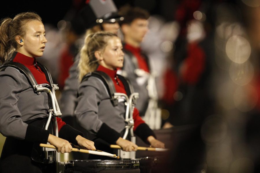 Senior Caroline Norris focuses as the band performs their halftime show, Clouds, at the Sept. 23 game against Dallas Skyline.