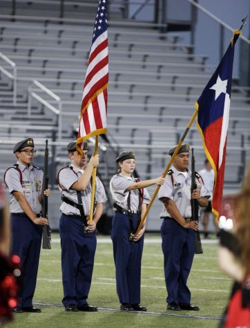 JROTC cadets hold the flags before a football game on Sept. 23 at Vernon Newsom Stadium.