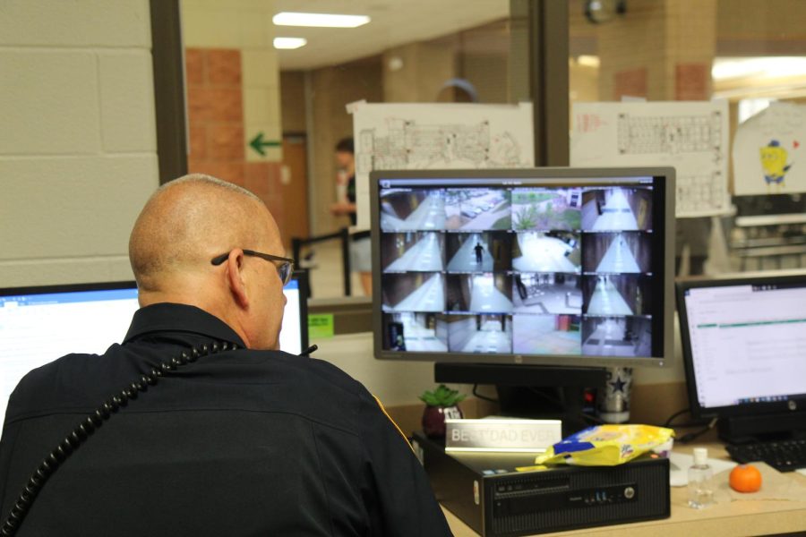 Officer John Godwin reviews security footage throughout the building. 