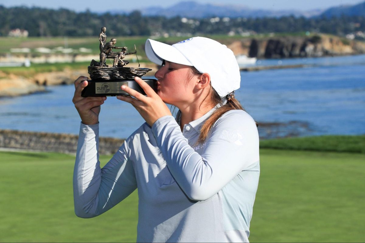 Senior Alyssa Stewart poses with a trophy after placing at the Pure Insurance Championship tournament on Sept. 23 and 24 in Pebble Beach, CA. 