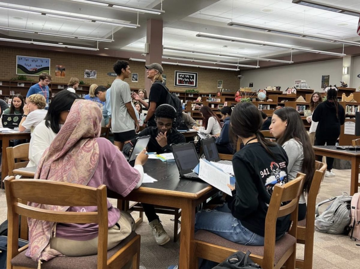 Members of the Science National Honor Society work with students during their tutoring day on Oct. 25. Photo by Legacy Science National Honor Society on Instagram.