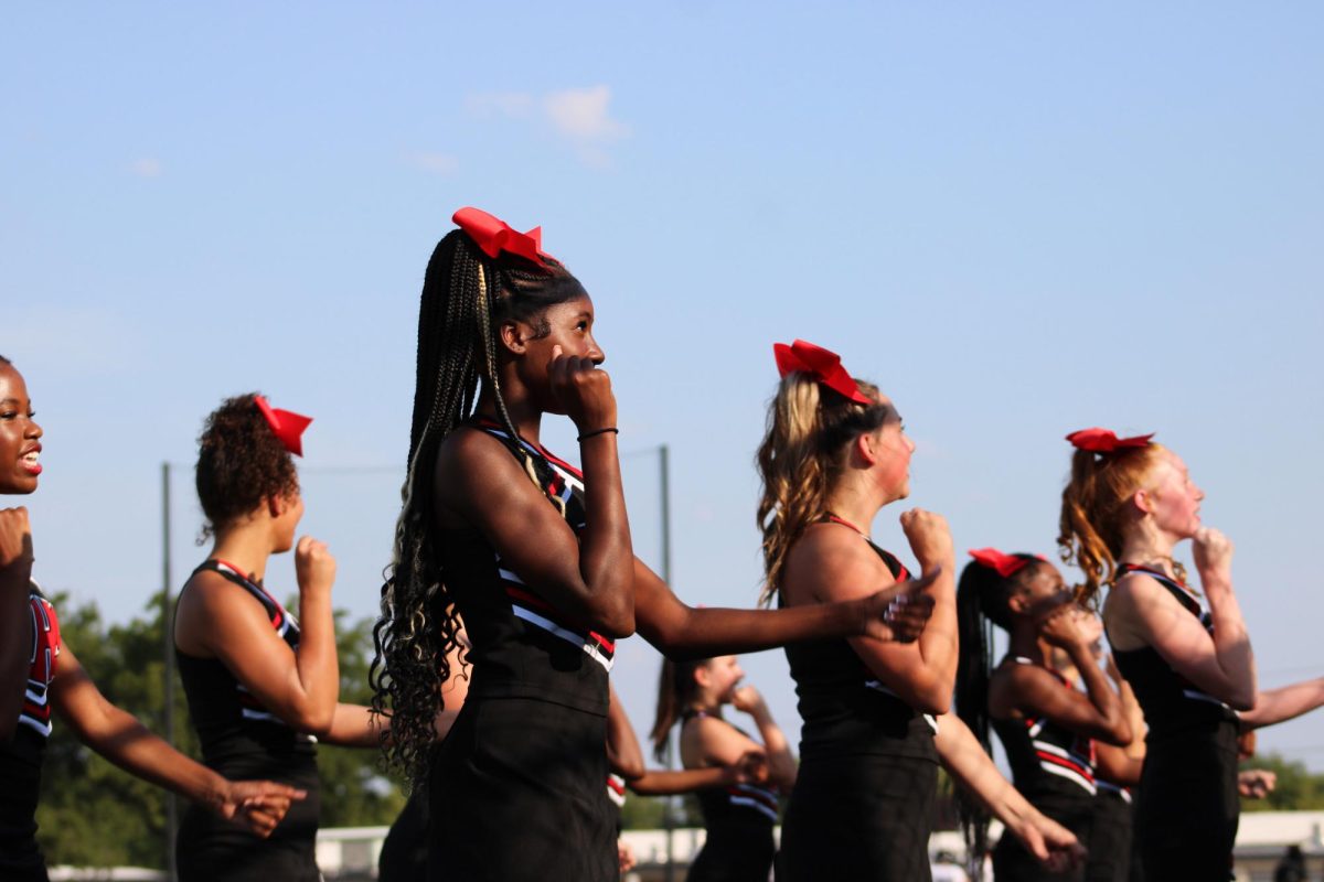 After legacy scores a first down, the cheerleaders root for the offense.