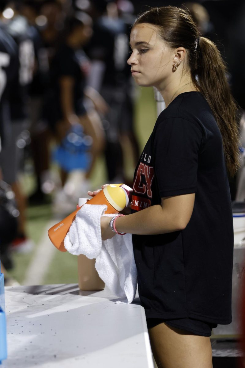 Throughout the game, trainers fill and send out waters to keep players hydrated through the heat.