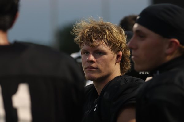 While in halftime, Landon Isabell, 12, listens in to his coaches plans for the next play.