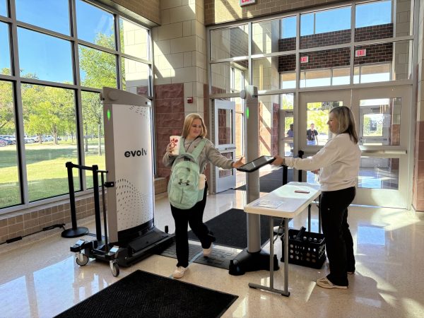 Students walk through the Evolv system as the come into school. Students are now required to go through Evolv bag checks before boarding the bus or vehicle when traveling for school trips.