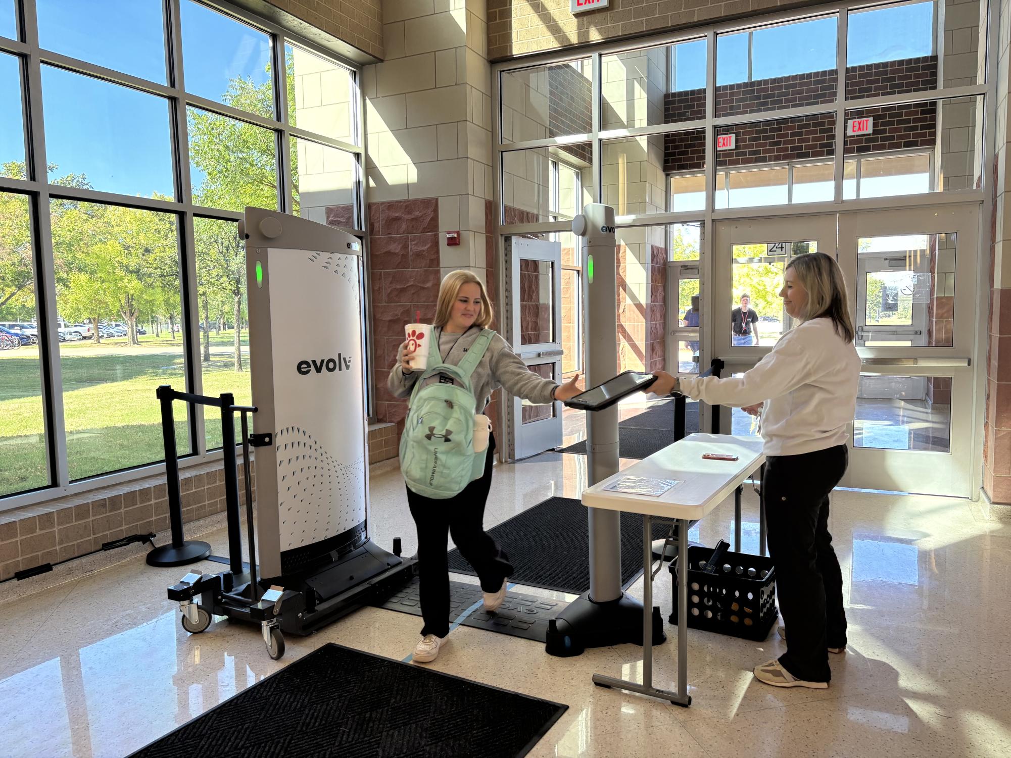 Students walk through the Evolv system as the come into school. Students are now required to go through Evolv bag checks before boarding the bus or vehicle when traveling for school trips.