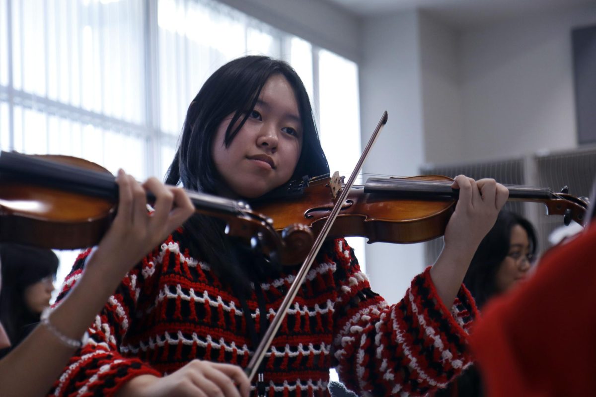 Nicole Khong, 10, plays a piece on her violin in varsity orchestra class at Ben Barber on  Sept. 9.