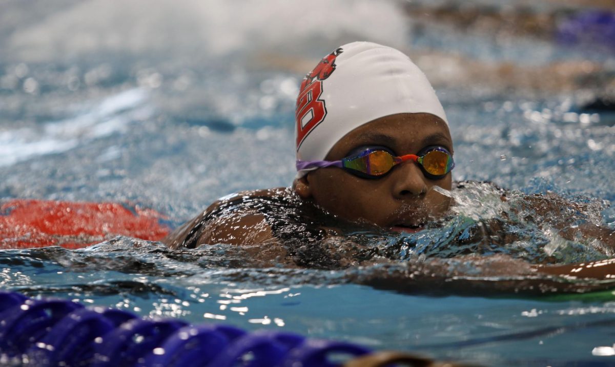 Chandler Garrett, 12, swims at varsity practice.  