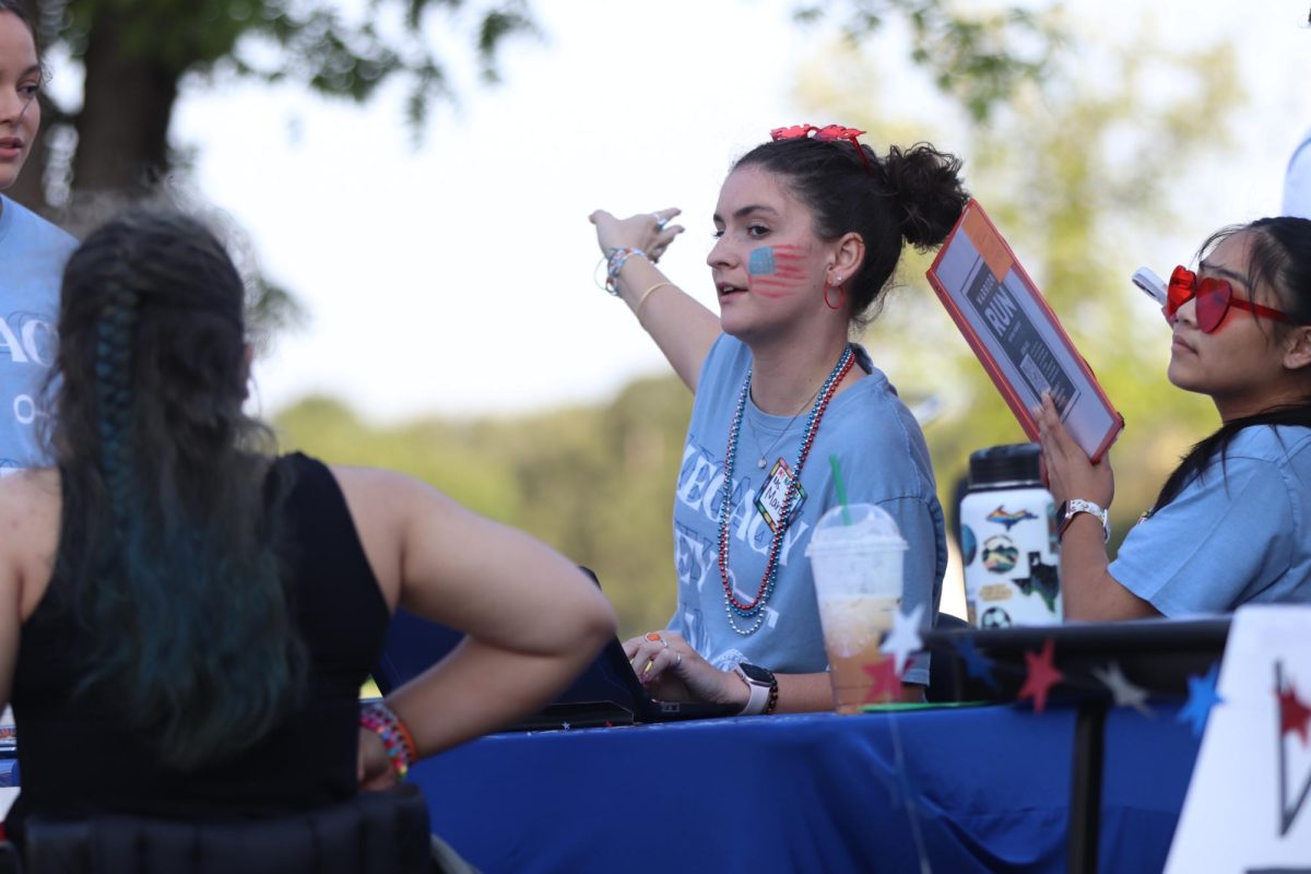 Abigayle Marion along with other key club volunteers registers race participants. Key Club raised $1,750 for the Wounded Warrior Project from Warrior Run.