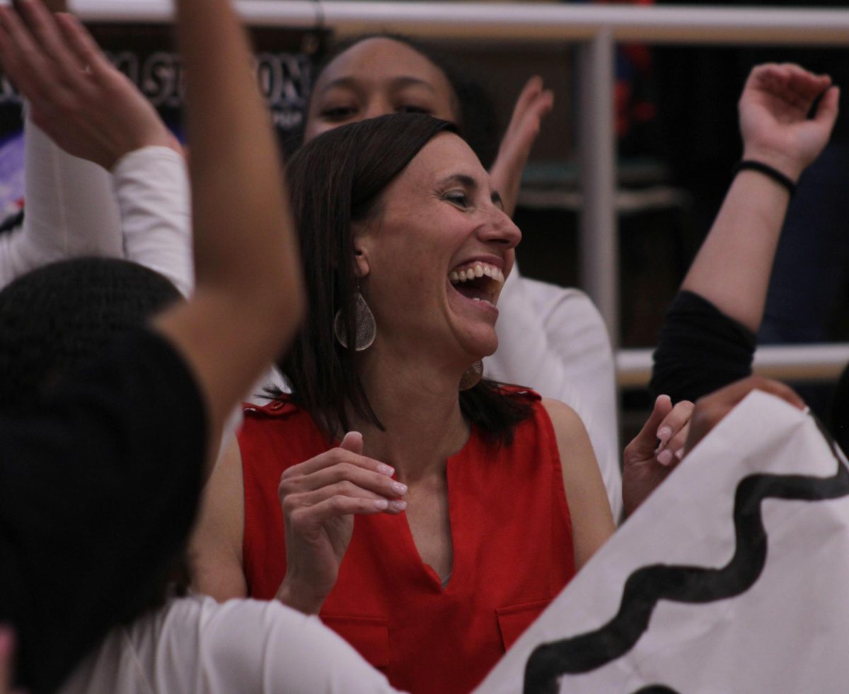 Varsity Volleyball coach, Amanda Shingleton, celebrates with the varisty team on her 400th career win. They played Crowley and won 3-0.