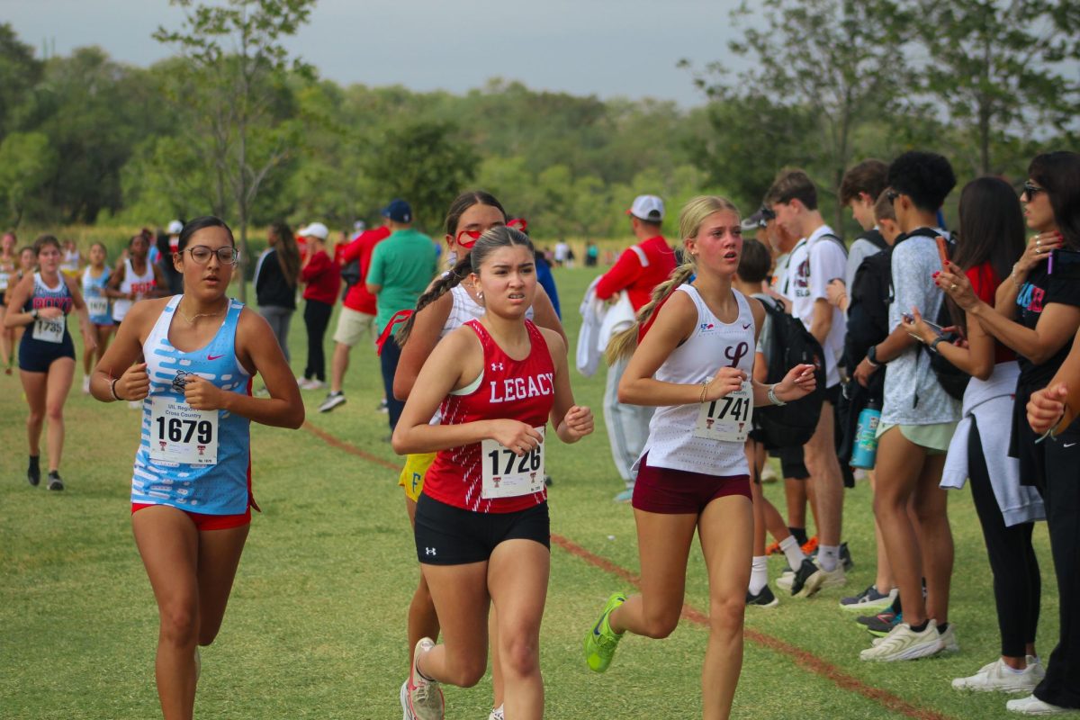 At the girls UIL regional cross country meet,  Yizel Castillo, 11, runs down the final stretch of the 5,000 meter race.