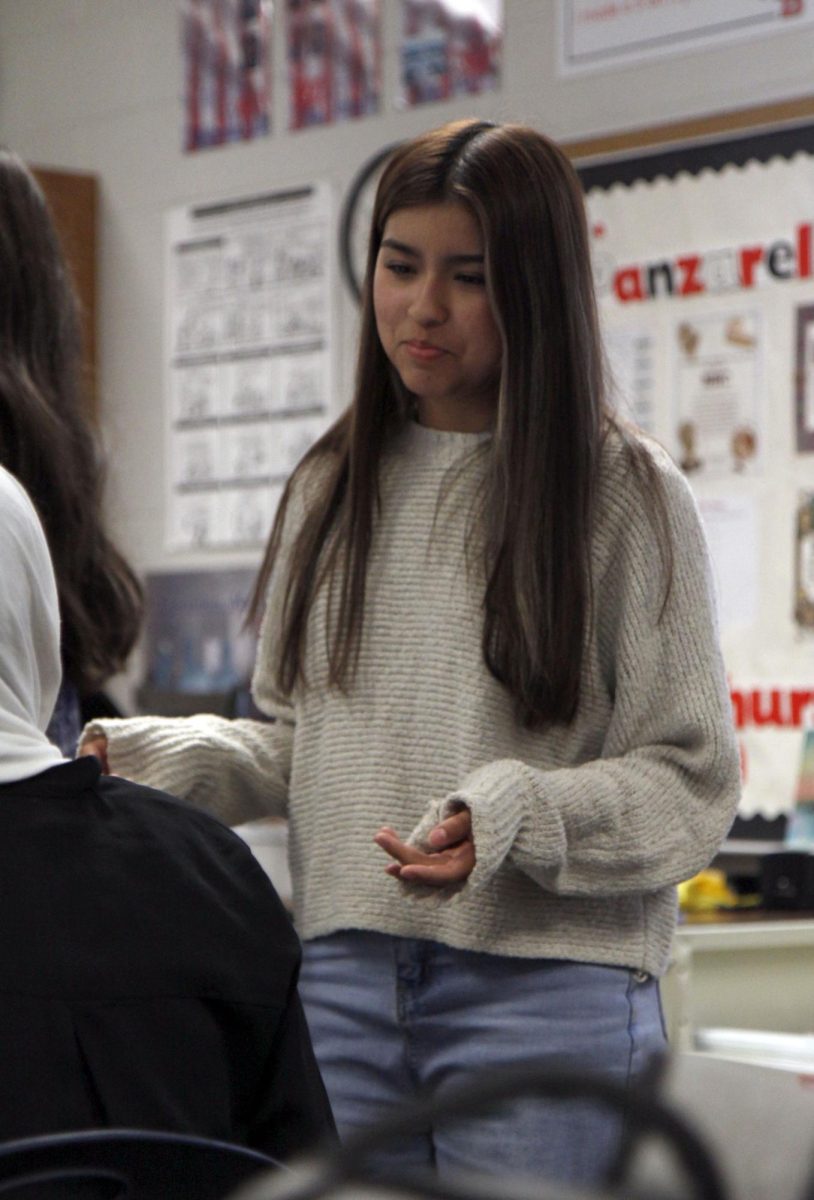 National History Club Treasurer Yizel Castilo, 11, answers Amtul Chaudhry, 10, questions about history. The National History Club’s next meeting will be on Nov. 18 on the second floor in room T203. 