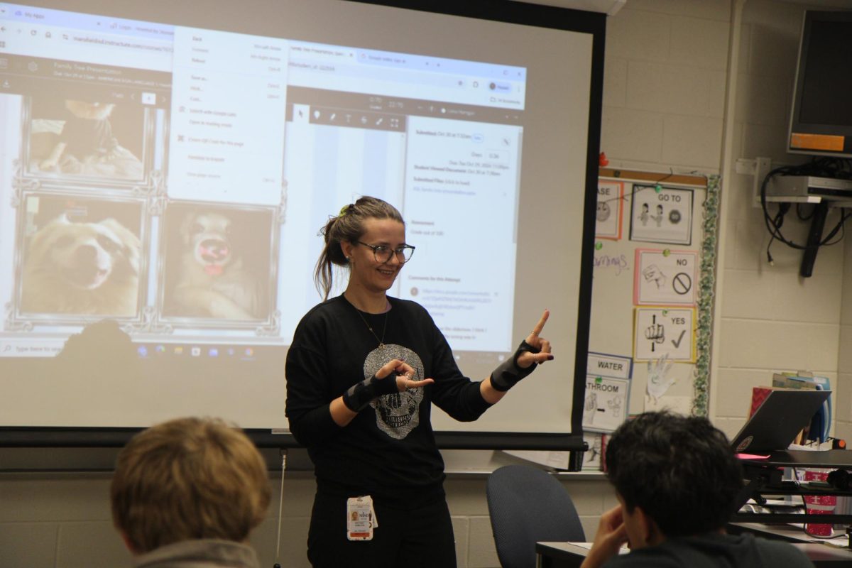 ASL Teacher, Ms. Brittany Hamilton, signs to her class on Oct. 29.