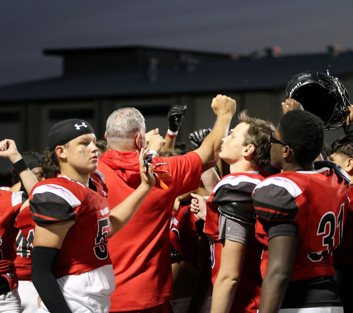 Coach Mark Walker gives the JV B team words of encouragement to uplift them from their loss against Mansfield on Oct. 17. 