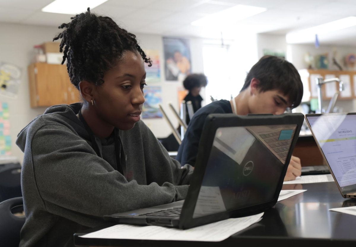 McKinley Hatch, 11, works in AP Biology. McKinley helped start the after school Book Club with friends. 