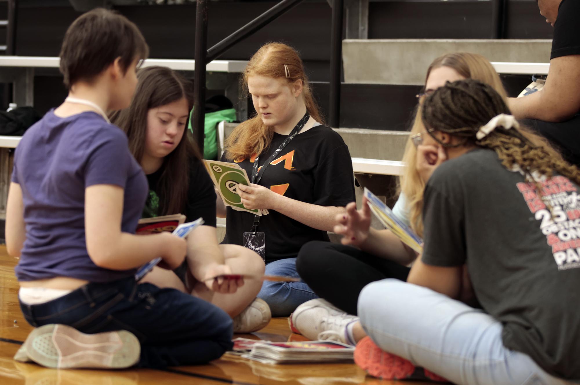 During partners in PE, senior Grace Gandy plays Jumbo Uno with her peers.